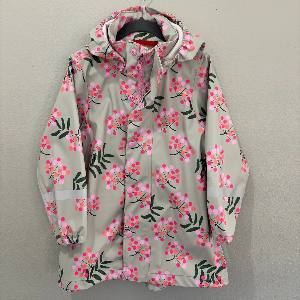 Reima tan raincoat with pink, orange and green flowers, removable hood